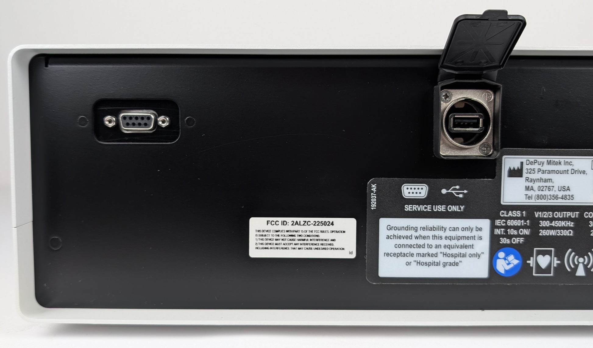 Back view of a electronic device with ports and labels